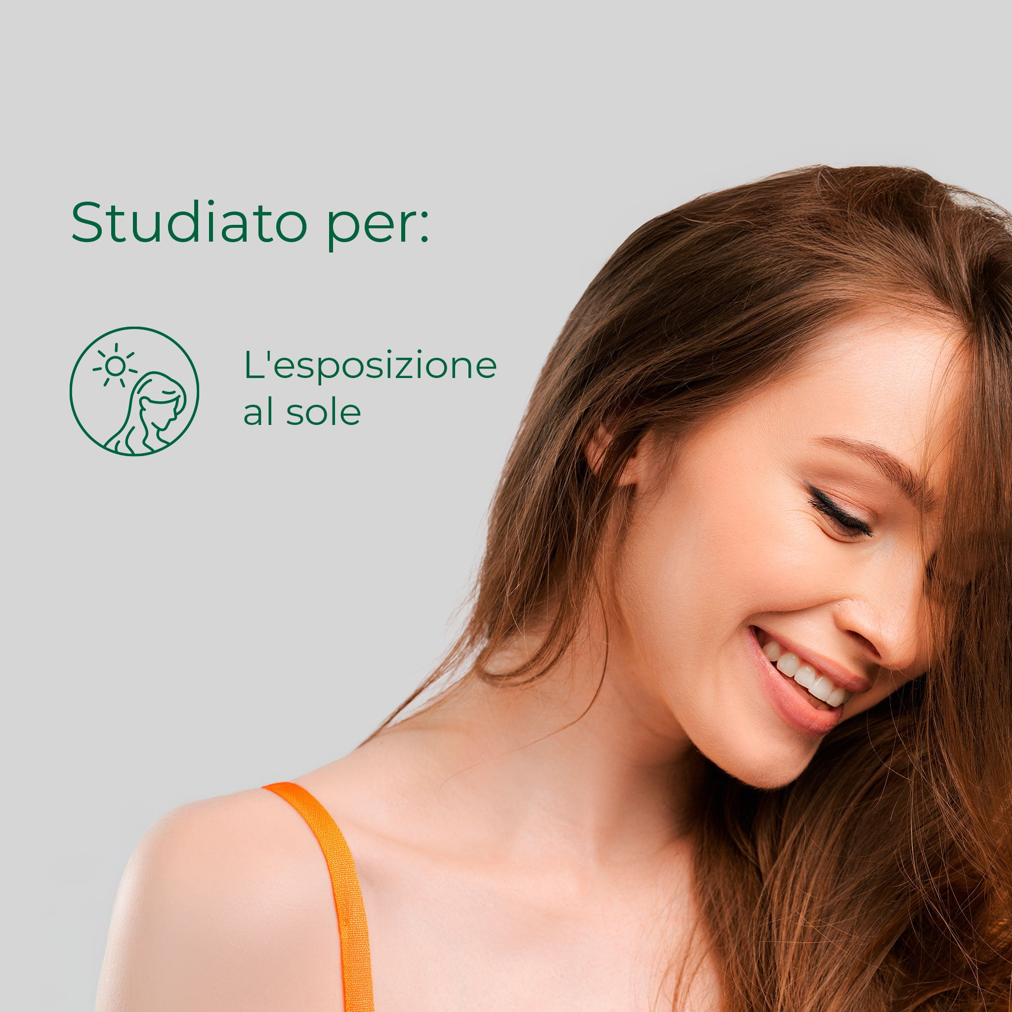 Donna sorridente con capelli fluenti: Bioscalin® Benessere SOLE è l'integratore studiato per l'esposizione al sole