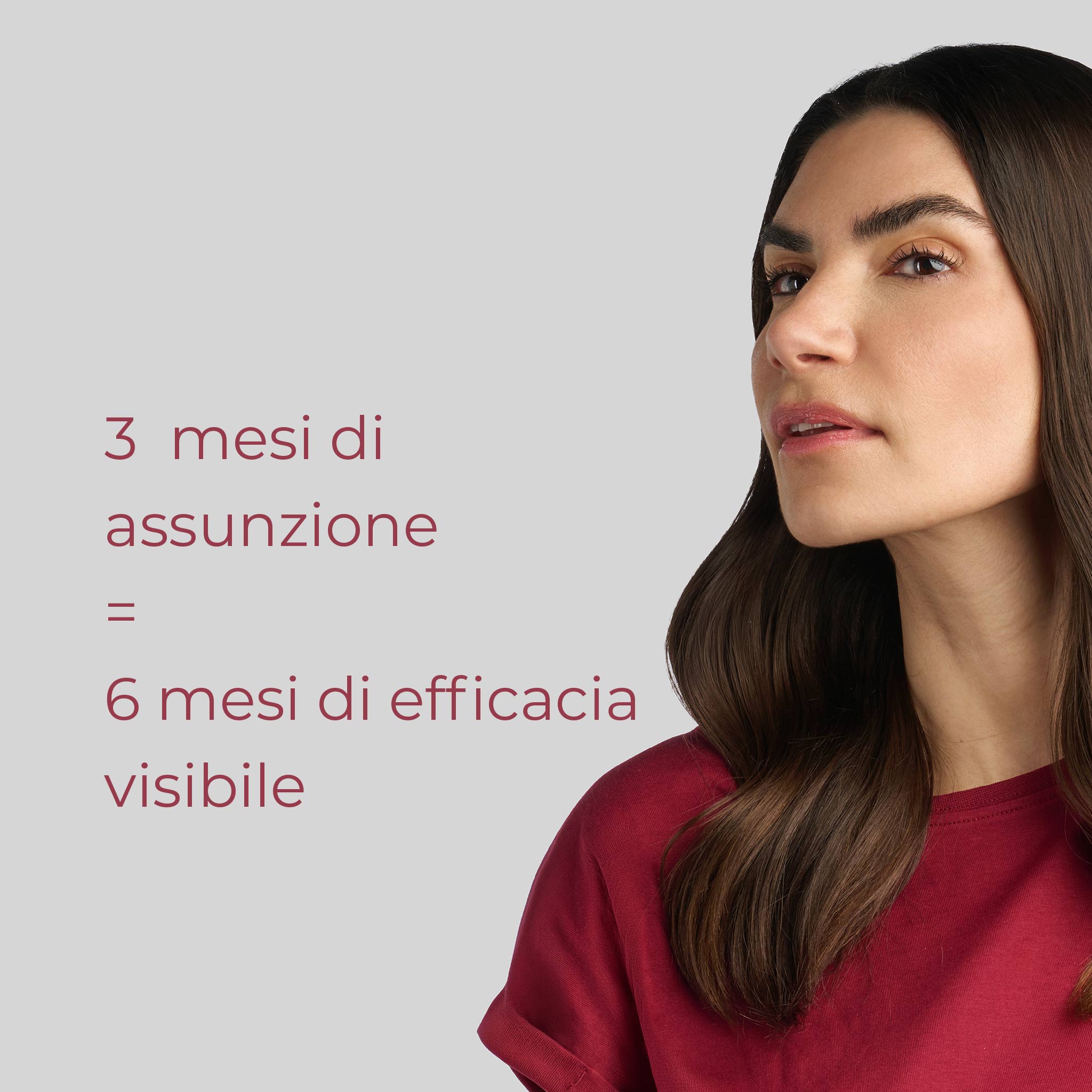 Primo piano di una ragazza mora che usa integratore Bioscalin® anticaduta per capelli linea Menopausa