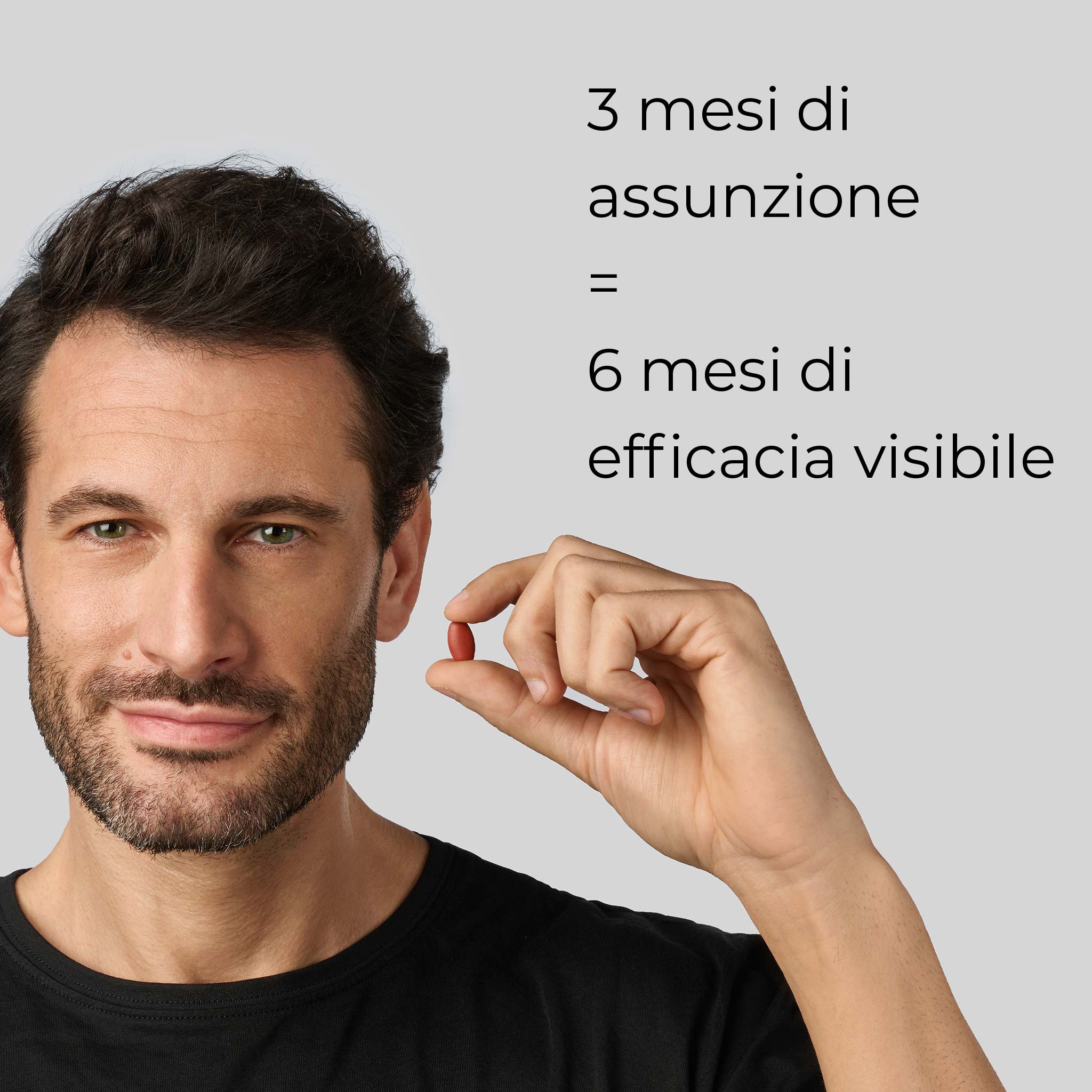 Primo piano di un uomo che afferra una compressa dell'integratore anticaduta Bioscalin® Pro•Density